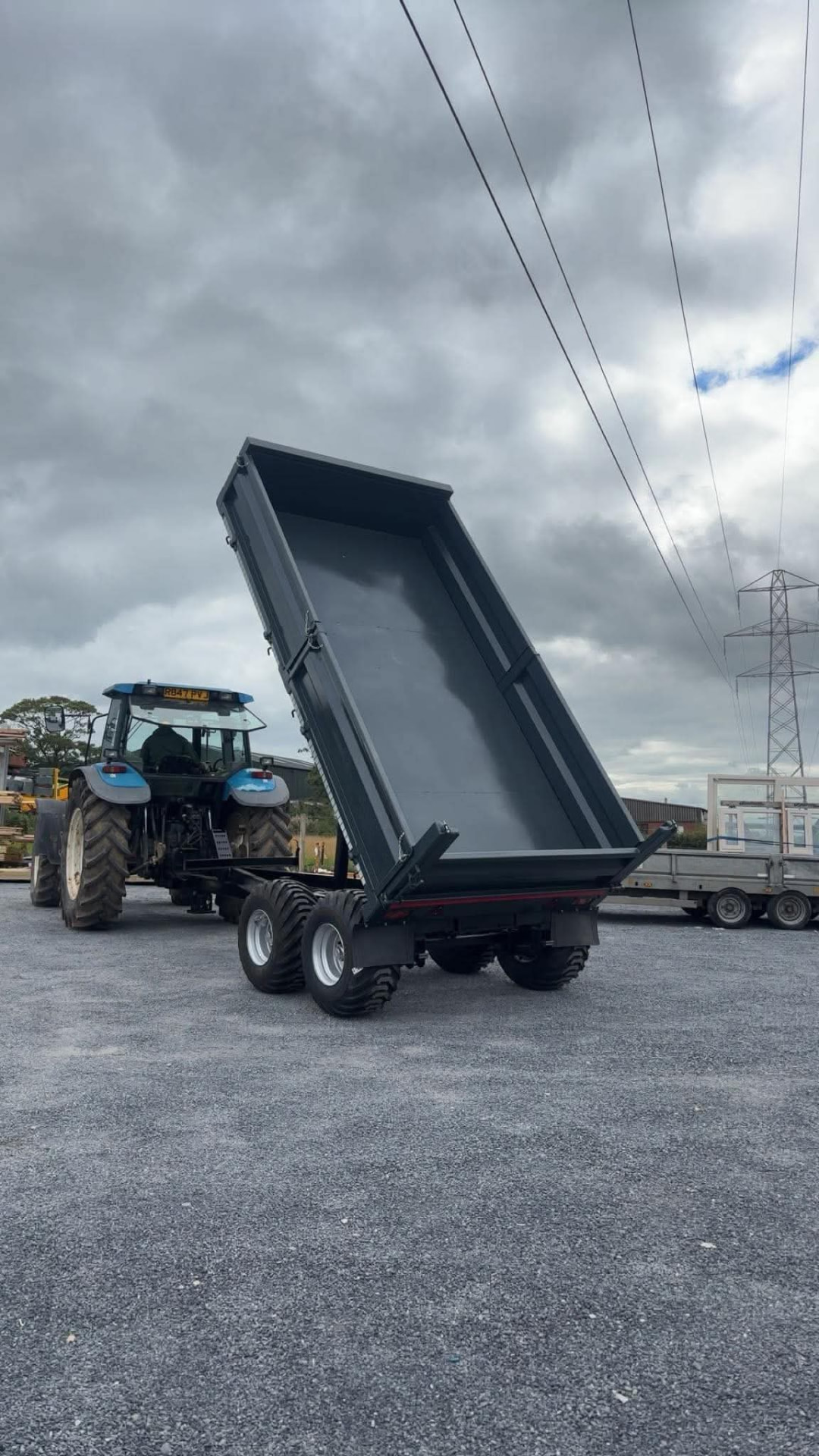 MT Plant tipping trailer tipped behind a tractor